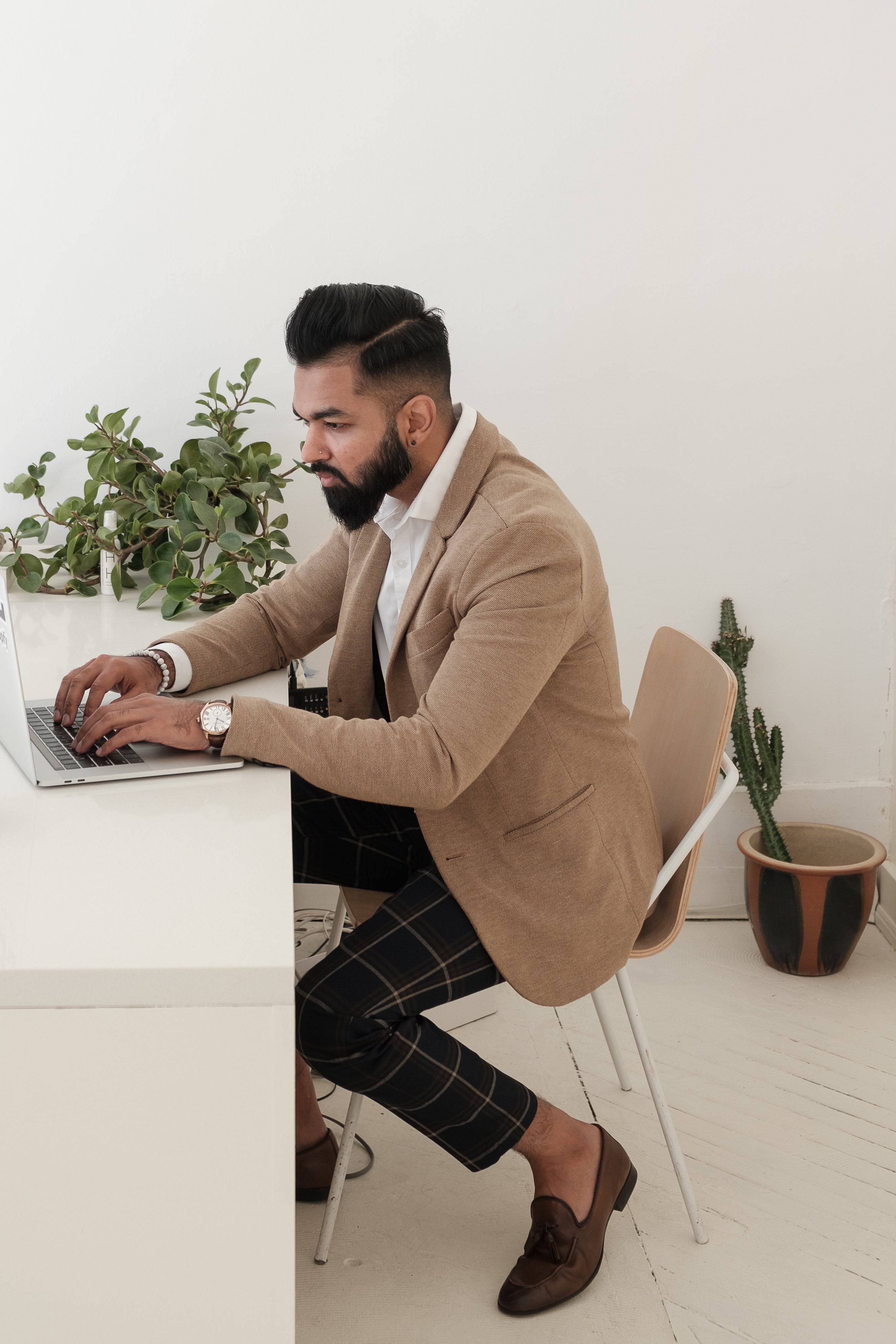 files/dapper-store-owner-working-on-laptop.jpg